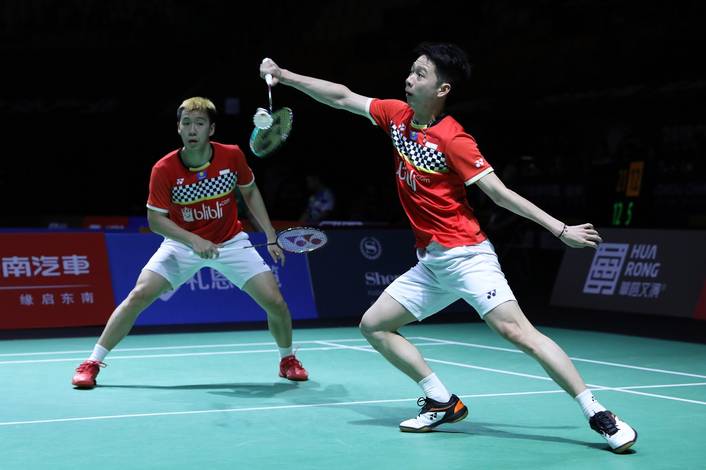 Kevin Sanjaya Sukamuljo/Marcus Fernaldi Gieon (Indonesia) menghadang serangan.